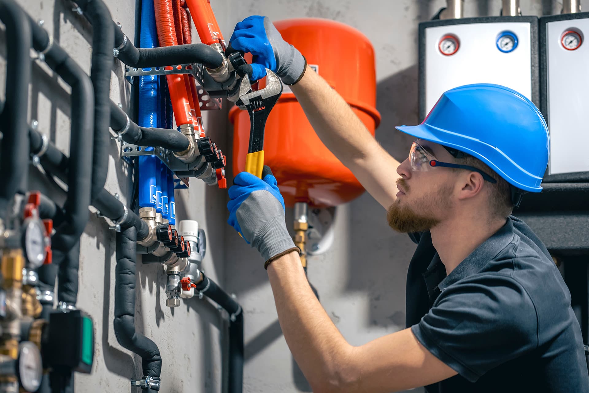 Plumber fixing a boiler